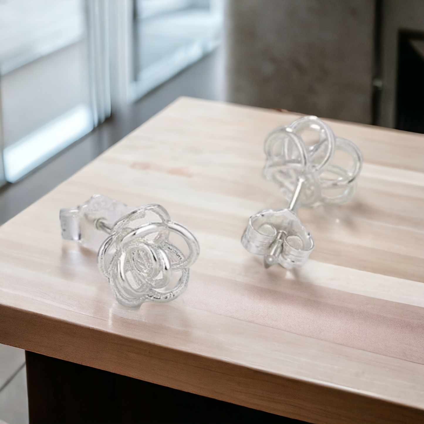Silver flower studd earrings
