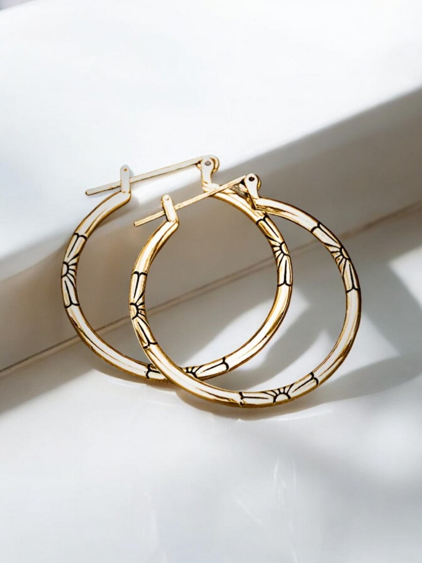 Floral embossed hoop earrings