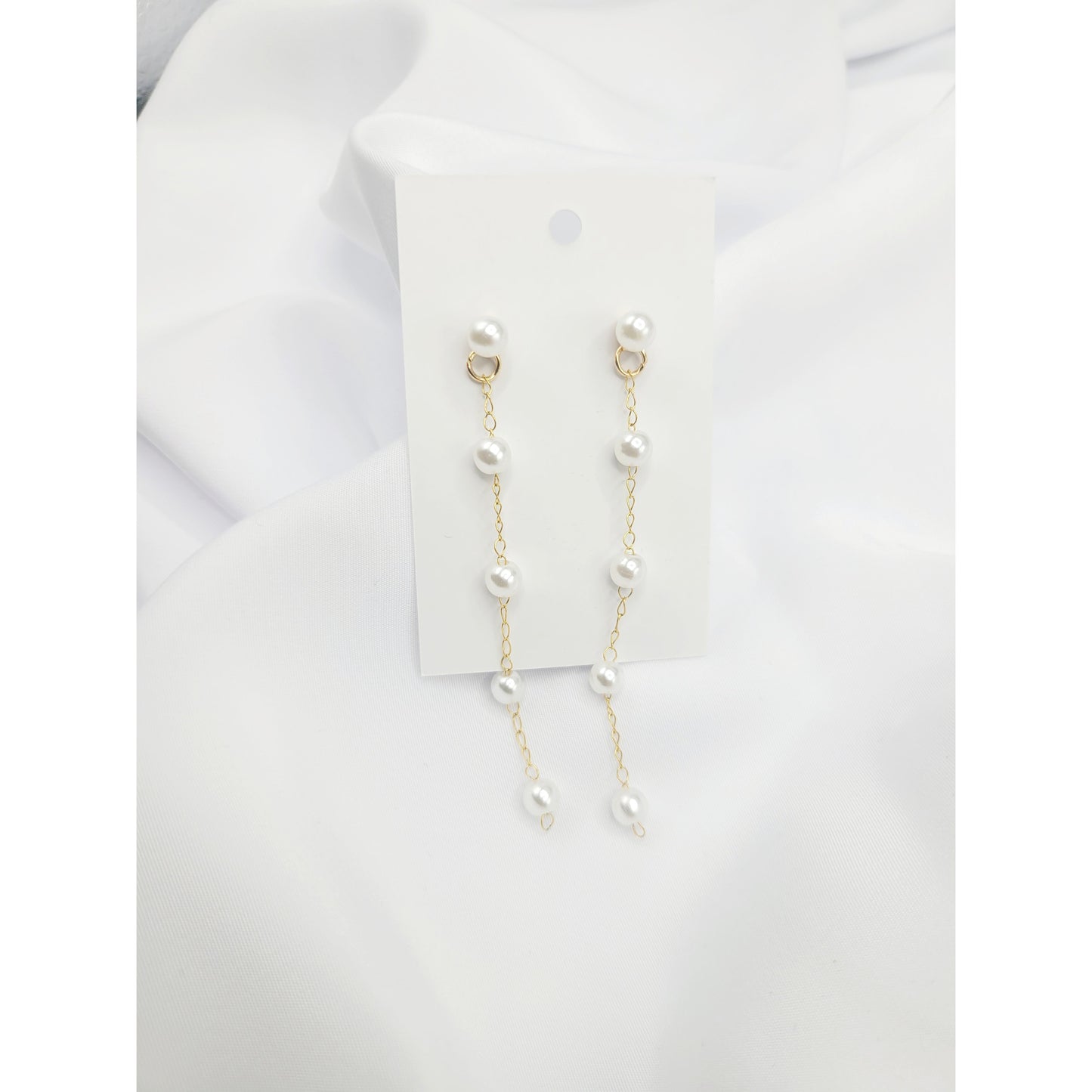 Suspended pearl earrings