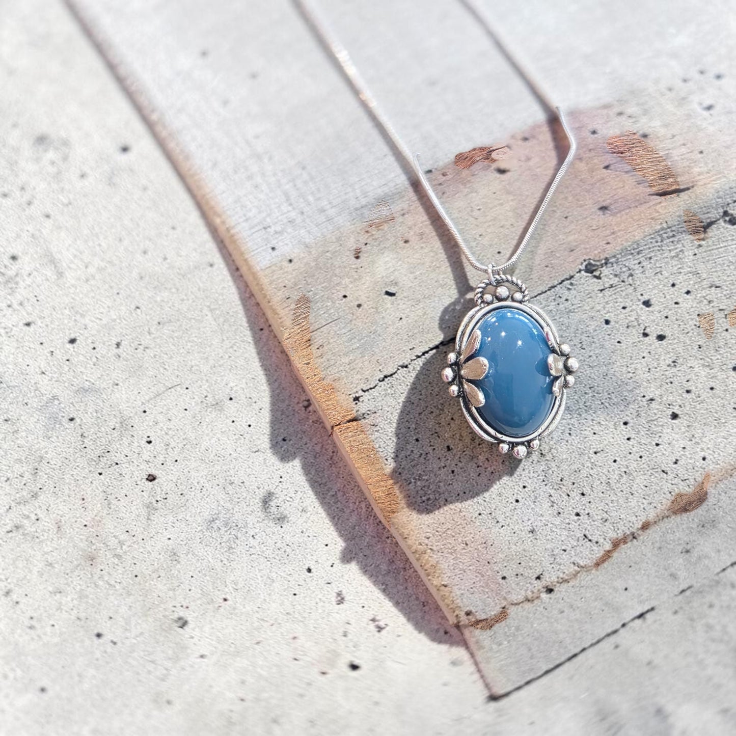 A blue embrace necklace