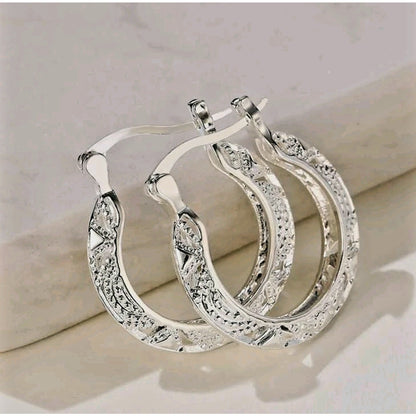 Ornate hoop earrings